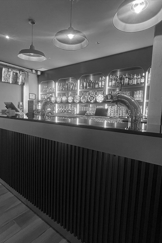 Bartender Preparing Cocktails in a Modern Bar for Customers